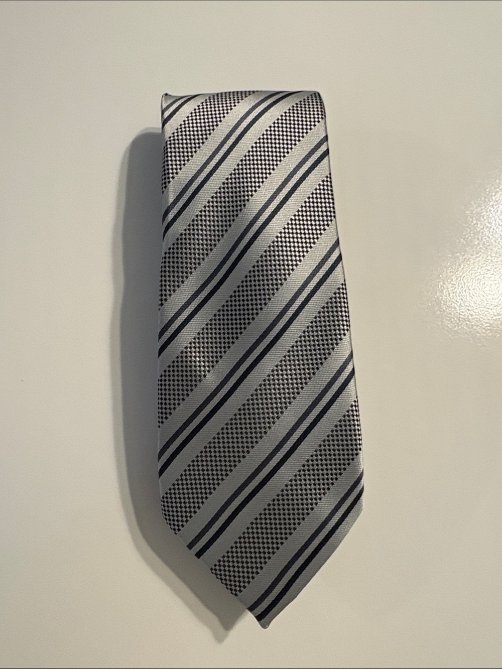 Silk silver, charcoal and navy tie 100% silk.
